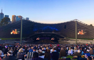 Emily Sun performing at the Sidney Myer Bowl with Melbourne Symphony Orchestra, conducted by Tianyi Lu.